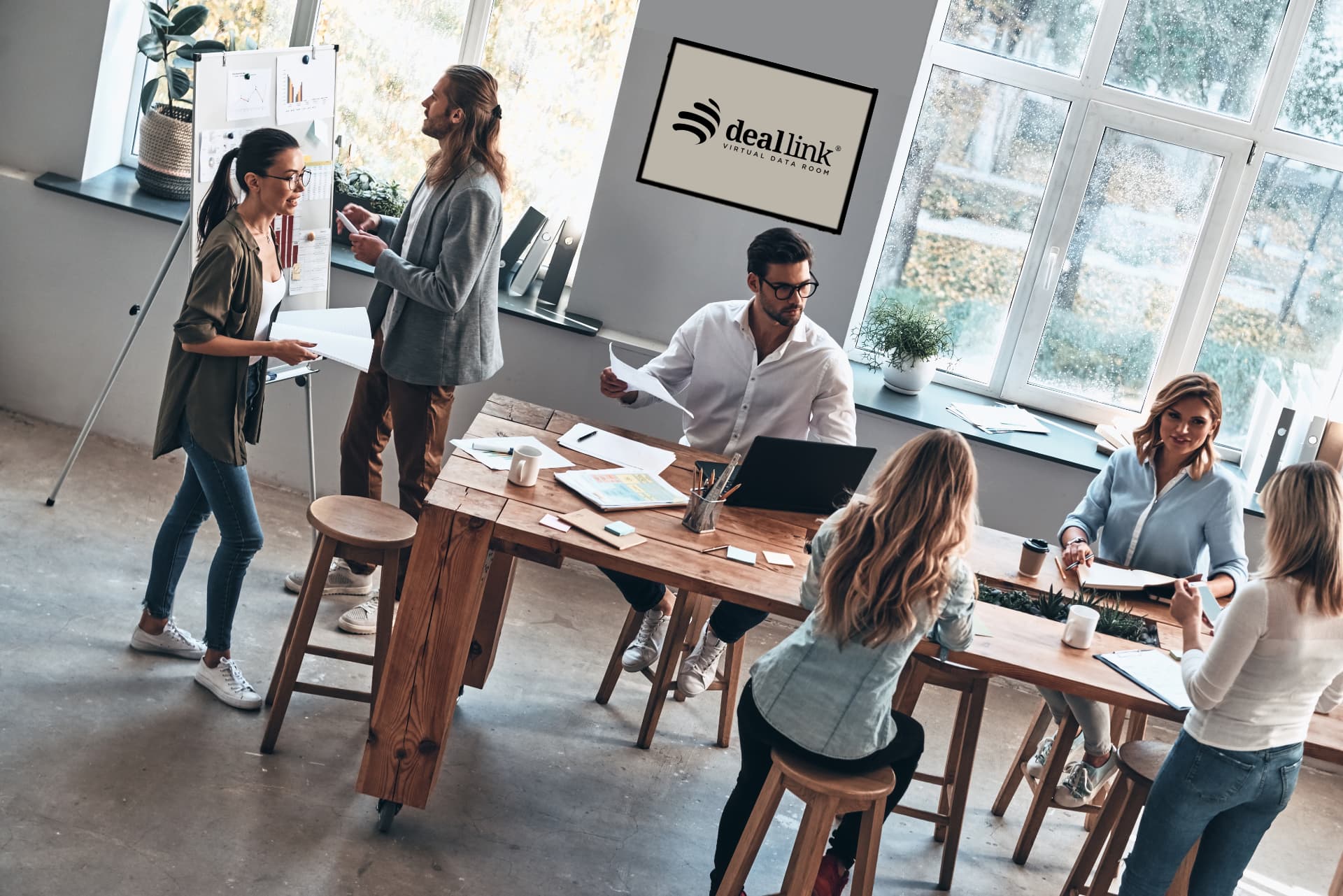 Deallink's global team in a working meeting at the office
